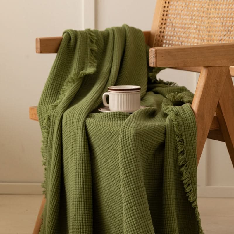Green four-layer waffle weave cotton throw blanket with fringe, Spring/Fall home decor.